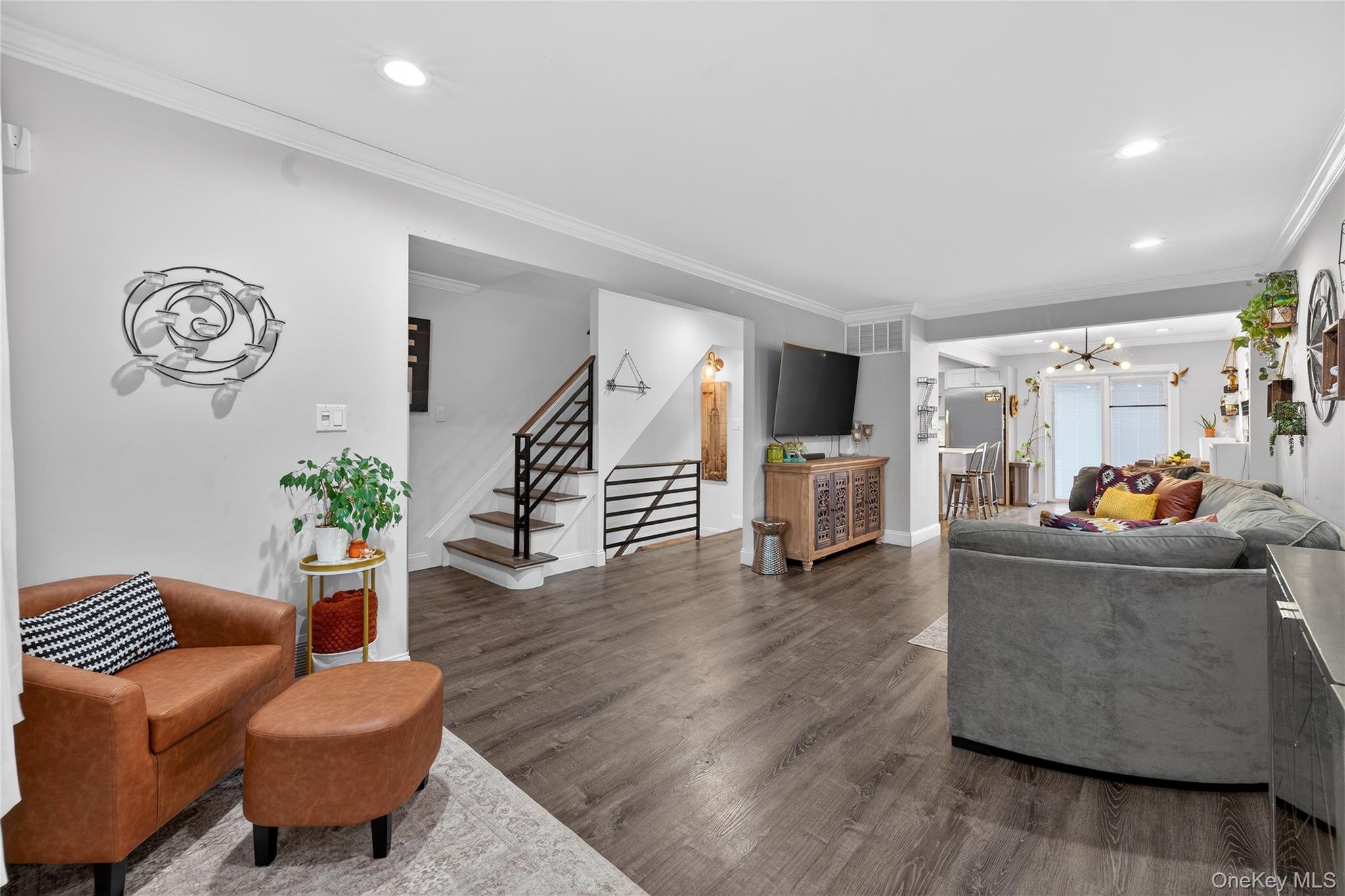 3530 Long Beach Road, Unit 8 Oceanside, NY 11572 - Photo 4 of 19 a living room with furniture and a wooden floor