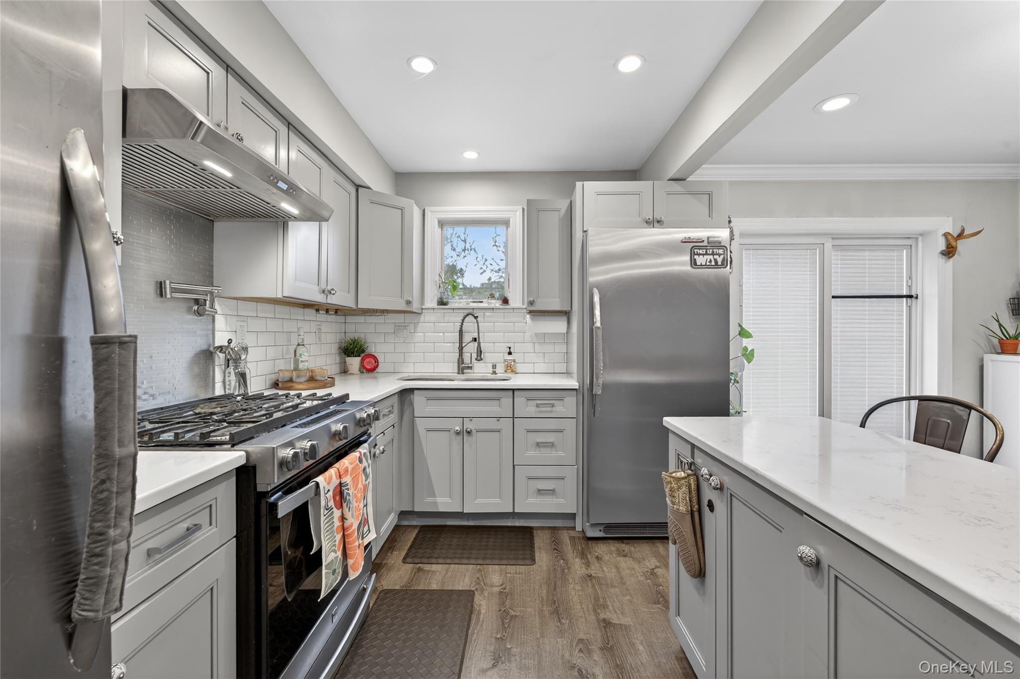 3530 Long Beach Road, Unit 8 Oceanside, NY 11572 - Photo 6 of 19 a kitchen with granite countertop a sink stainless steel appliances and cabinets