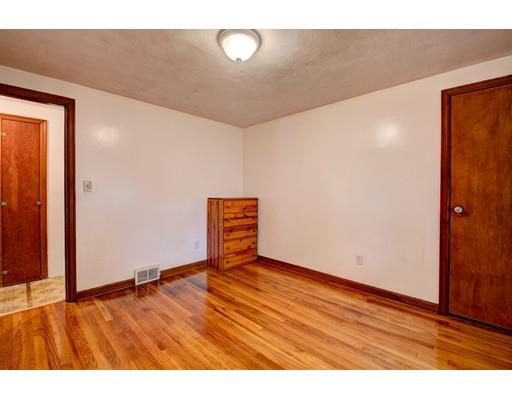 84 Campechi Street Springfield, MA 01104 - Photo 14 of 26 a view of an empty room with wooden floor