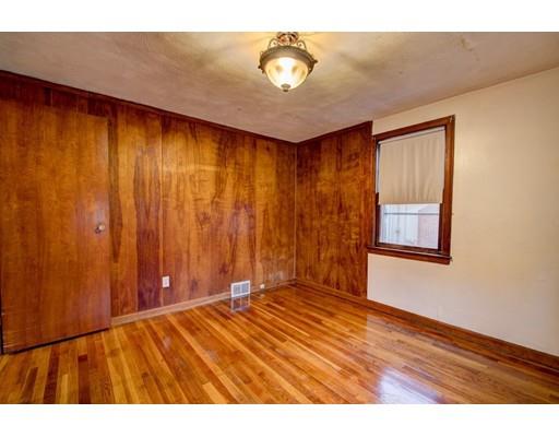 84 Campechi Street Springfield, MA 01104 - Photo 17 of 26 a view of an empty room with wooden floor