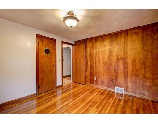 84 Campechi Street Springfield, MA 01104 - Photo 18 of 26 a view of an empty room with wooden floor