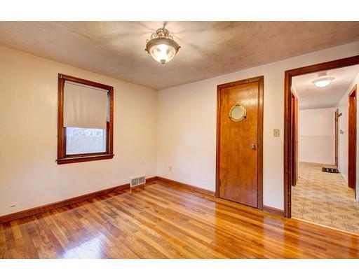84 Campechi Street Springfield, MA 01104 - Photo 19 of 26 a view of an empty room with wooden floor