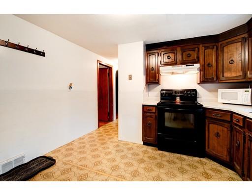 84 Campechi Street Springfield, MA 01104 - Photo 9 of 26 a kitchen with a stove and a refrigerator