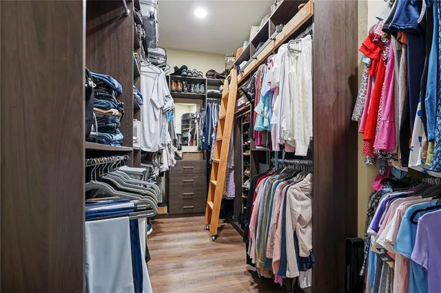 a bathroom with a sink a mirror and bathtub