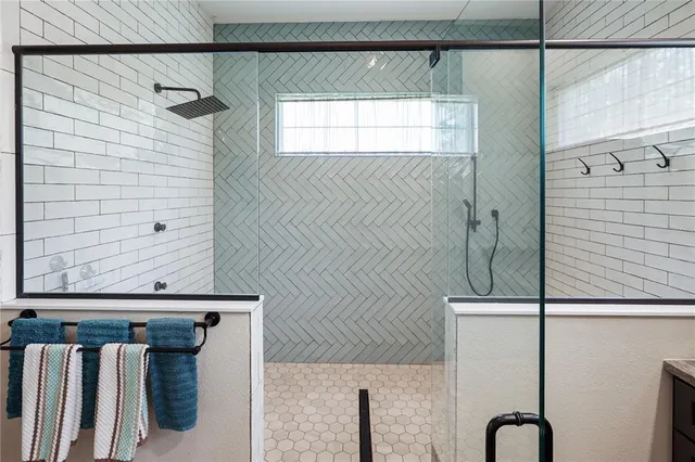 a kitchen with stainless steel appliances granite countertop a stove and a refrigerator