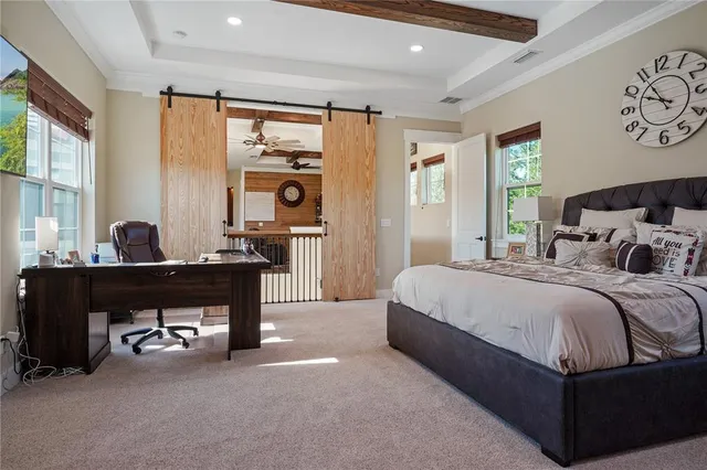a balcony with wooden floor table and chairs