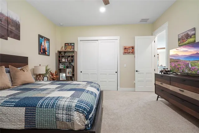 a living room with furniture and a baby crib