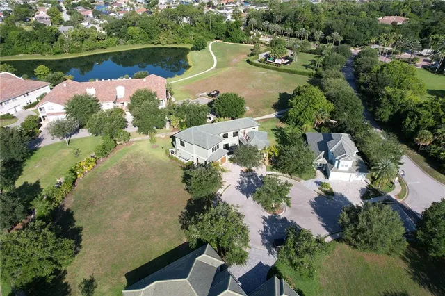 a view of a house with a yard and pathway