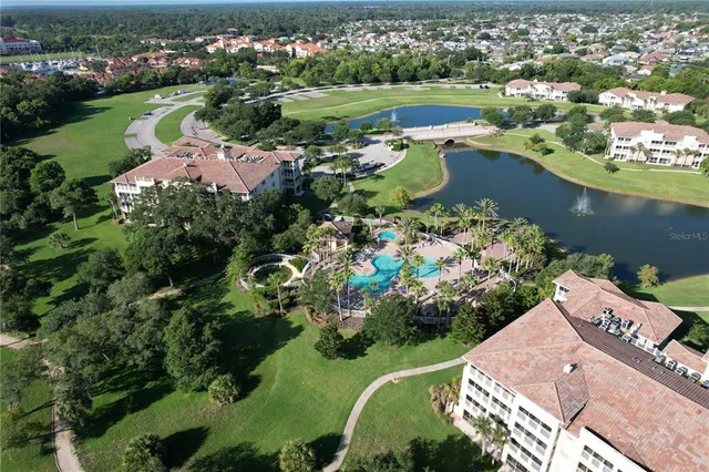 a living room with fireplace furniture and a potted plant