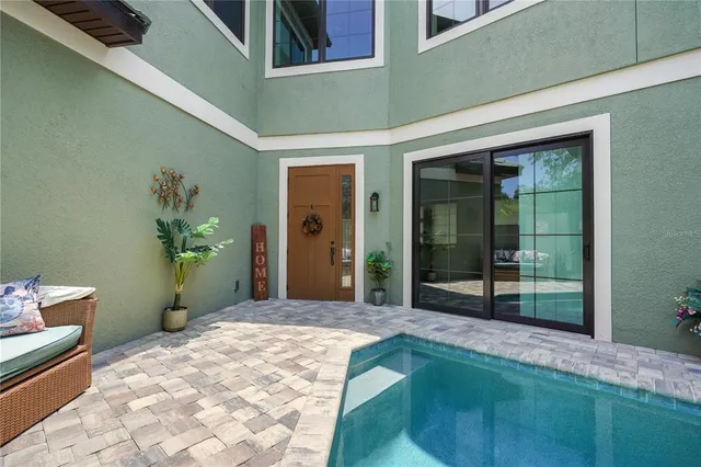 a kitchen with granite countertop a sink cabinets and stainless steel appliances