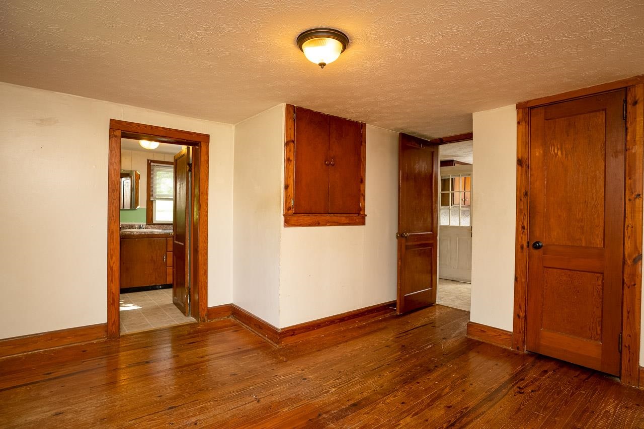 3697 Oak Ridge Road Mount Crawford, VA 22841 - Photo 14 of 34 an empty room with wooden floor and a window