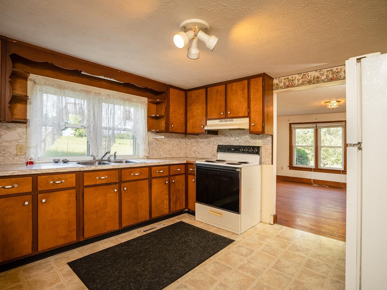 3697 Oak Ridge Road Mount Crawford, VA 22841 - Photo 2 of 34 a kitchen with stainless steel appliances granite countertop a stove a sink and a microwave