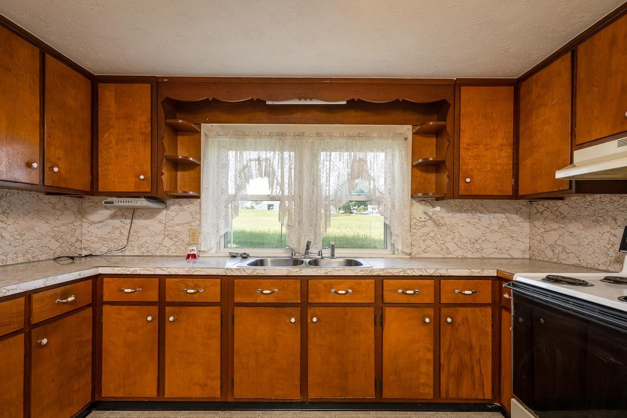 3697 Oak Ridge Road Mount Crawford, VA 22841 - Photo 3 of 34 a kitchen with stainless steel appliances granite countertop wooden cabinets a sink and a stove