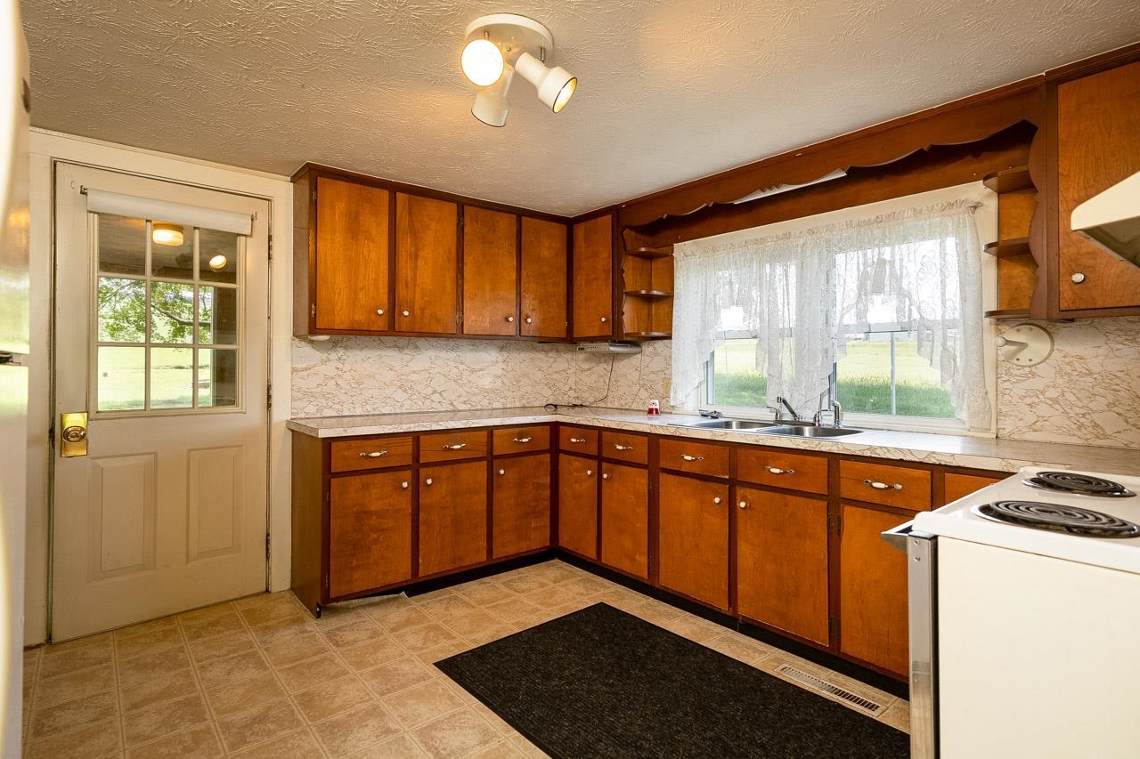 3697 Oak Ridge Road Mount Crawford, VA 22841 - Photo 4 of 34 a kitchen with stainless steel appliances granite countertop a sink a stove and a refrigerator