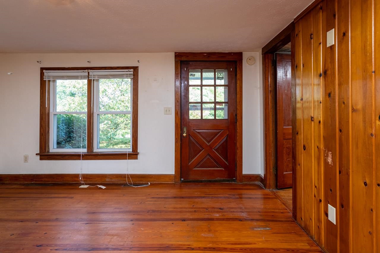 3697 Oak Ridge Road Mount Crawford, VA 22841 - Photo 5 of 34 a view of an empty room with wooden floor and a window