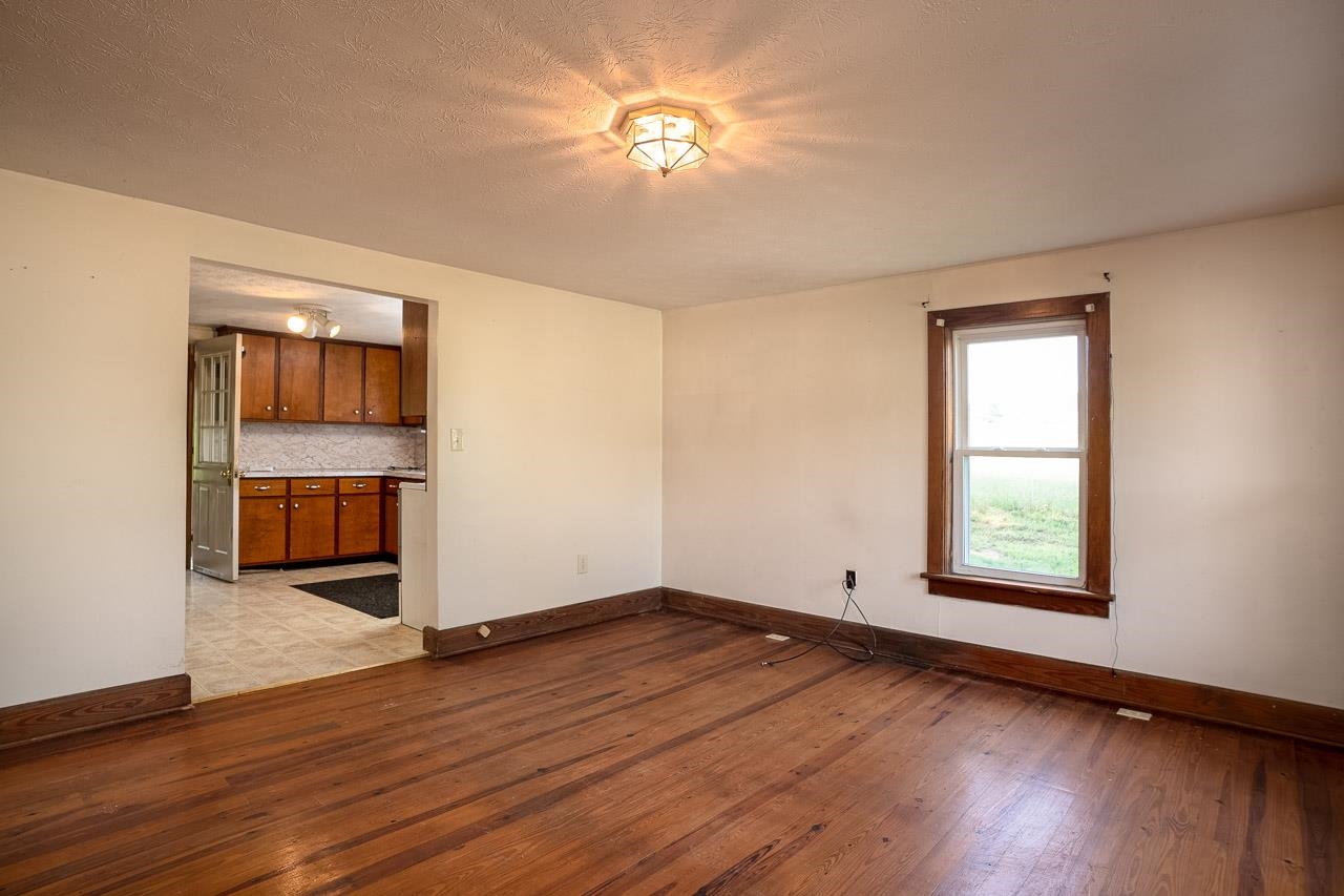 3697 Oak Ridge Road Mount Crawford, VA 22841 - Photo 7 of 34 wooden floor in an empty room with a window