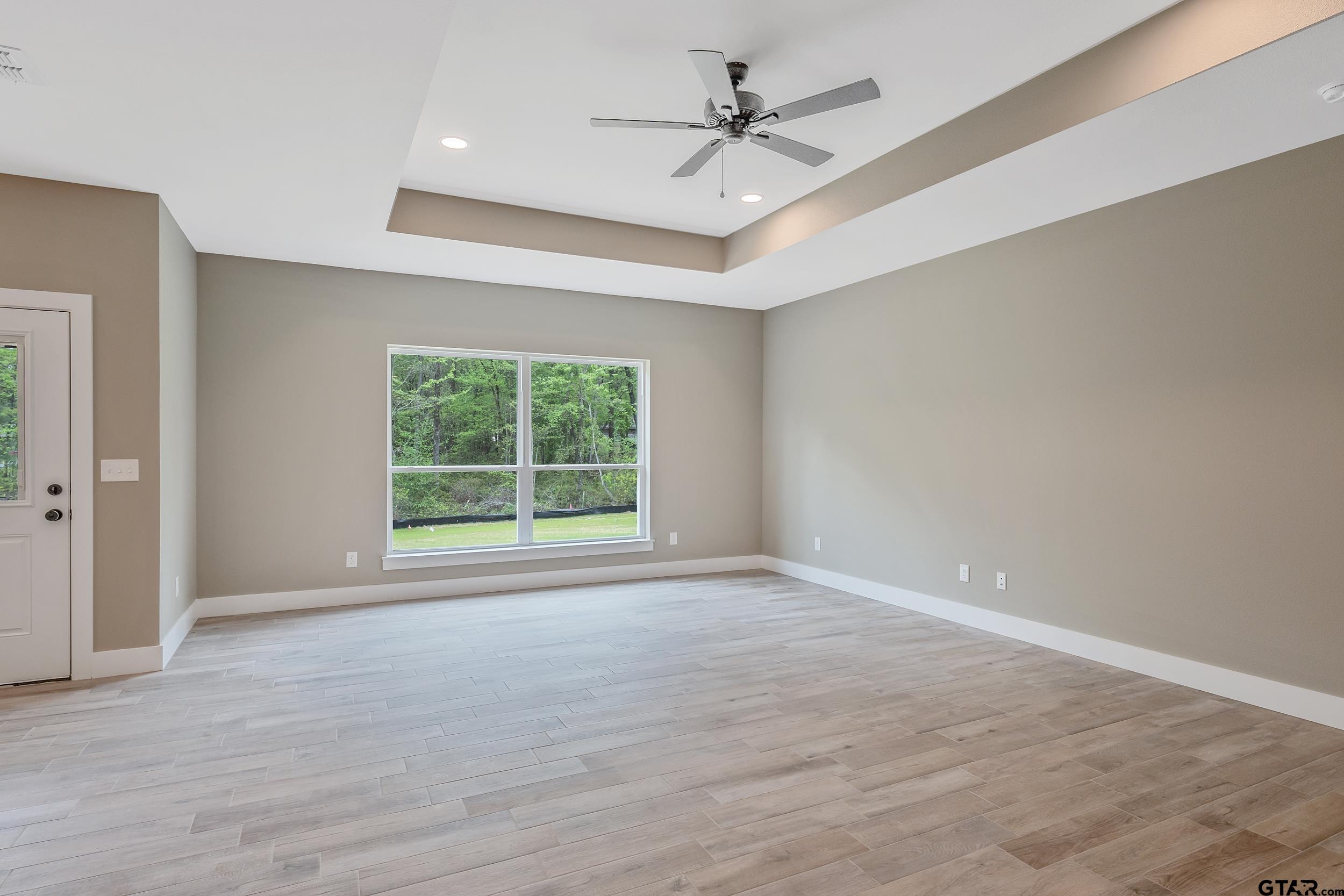 16218 Crossing Circle Lindale, TX 75771 - Photo 11 of 24 a view of an empty room with a window