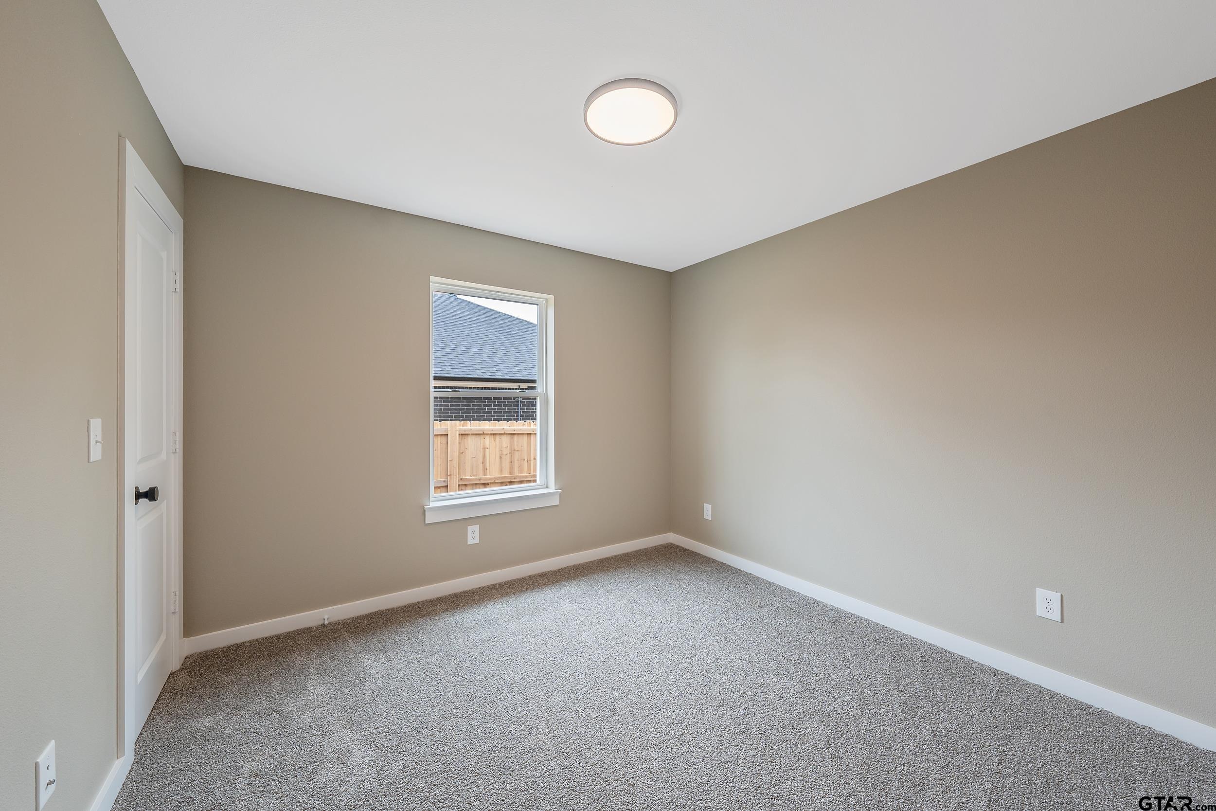 16218 Crossing Circle Lindale, TX 75771 - Photo 15 of 24 an empty room with a window