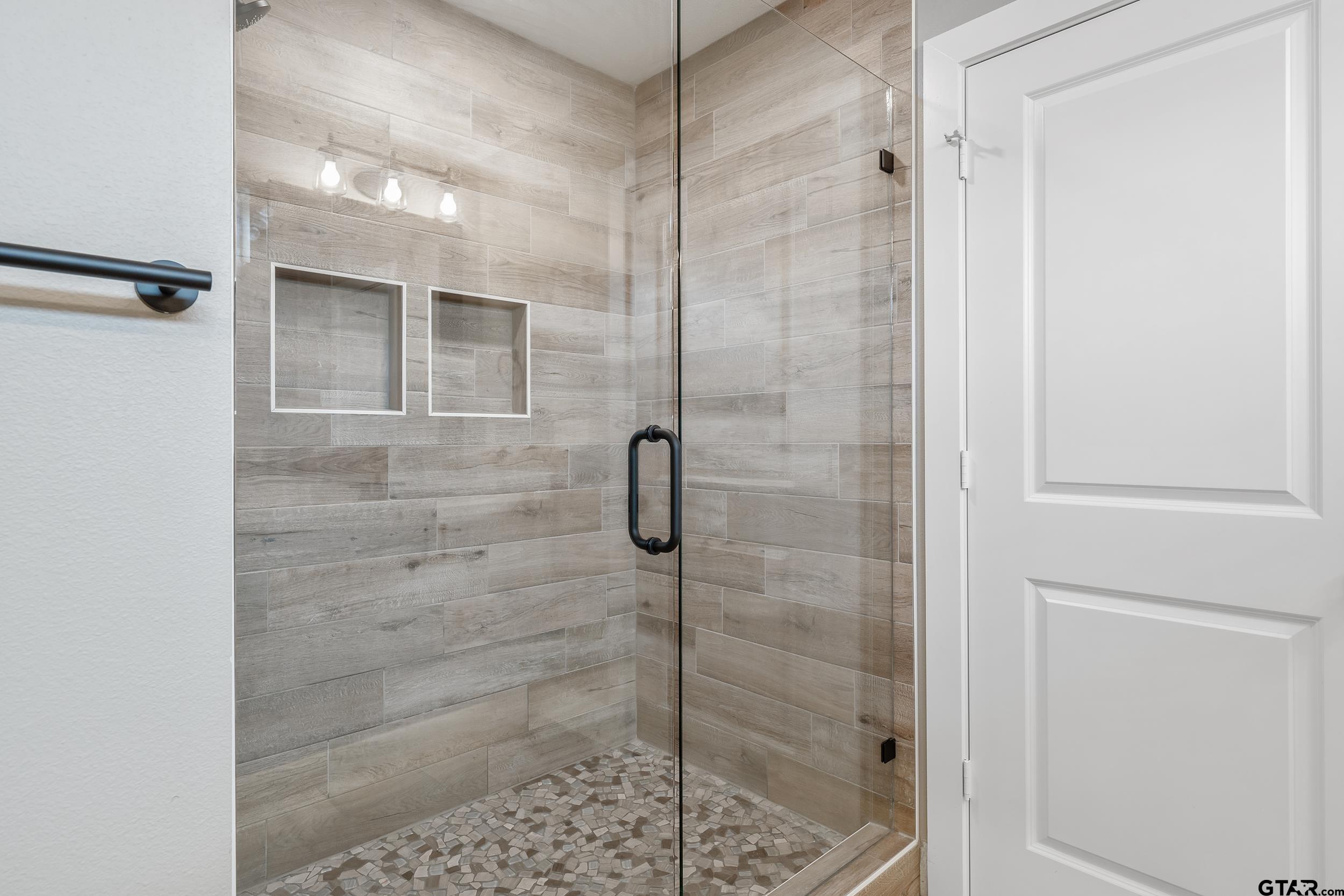 16218 Crossing Circle Lindale, TX 75771 - Photo 21 of 24 a bathroom with a shower