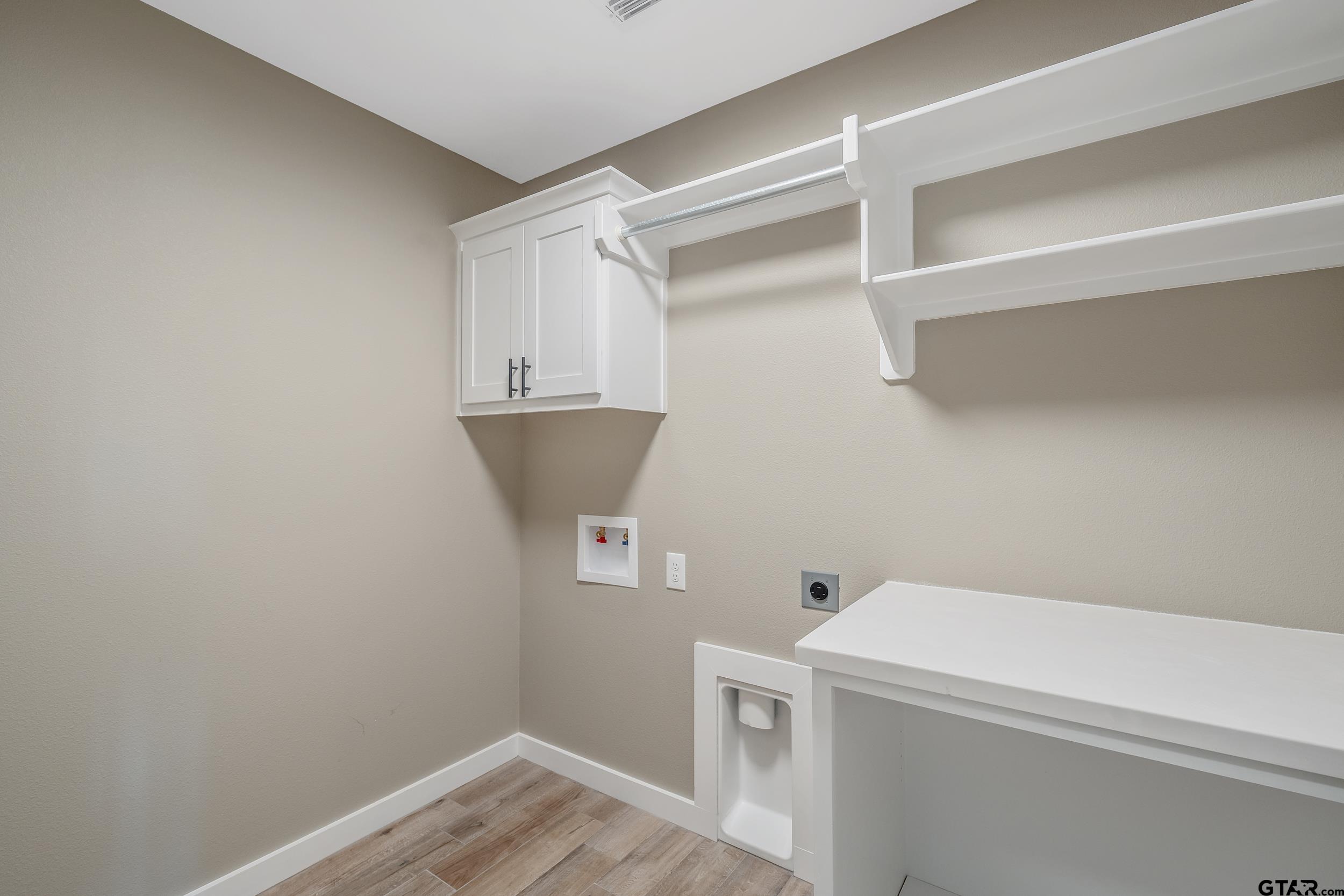 16218 Crossing Circle Lindale, TX 75771 - Photo 22 of 24 a view of storage and utility room with washer and dryer