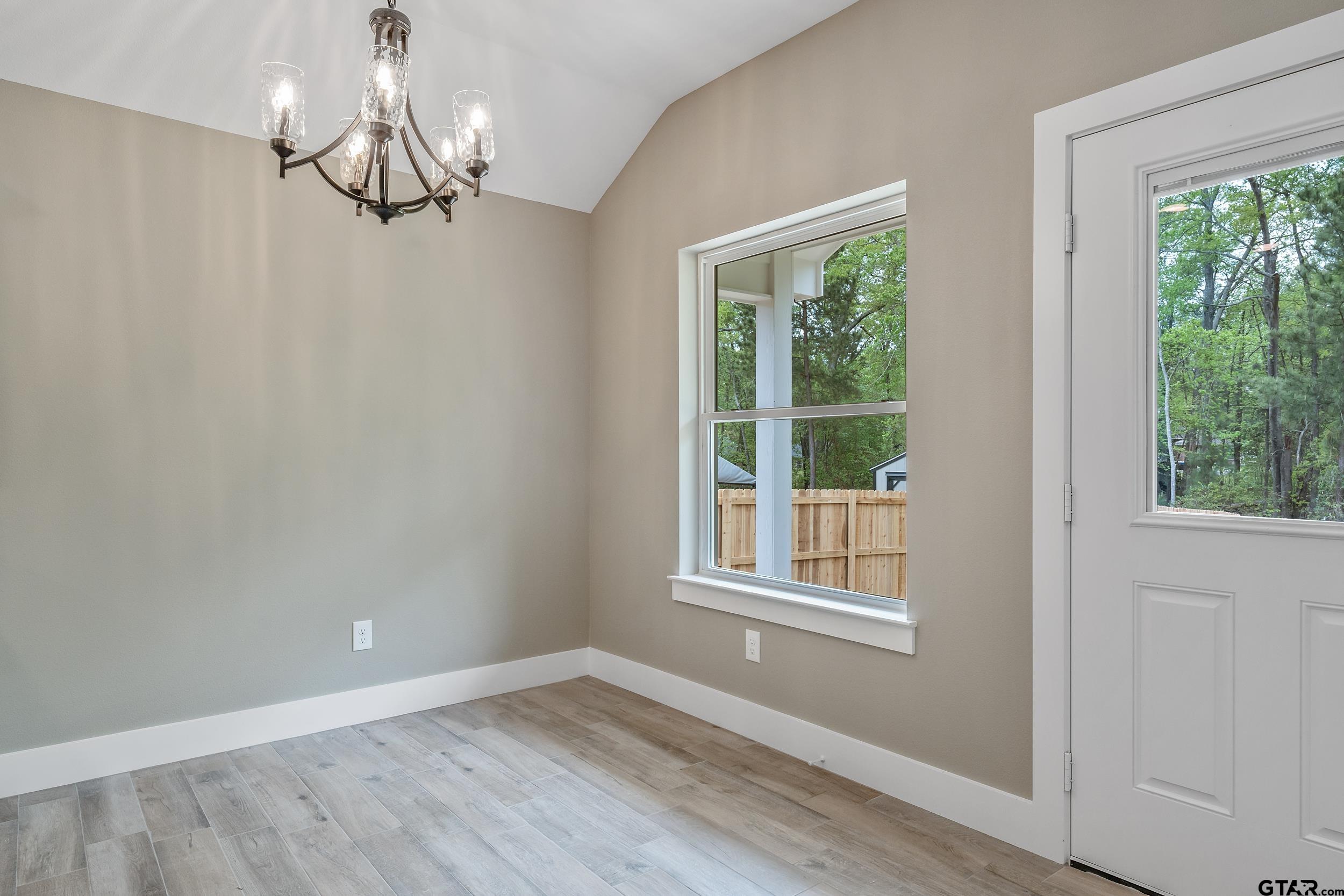 16218 Crossing Circle Lindale, TX 75771 - Photo 10 of 24 a view of empty room with wooden floor and fan