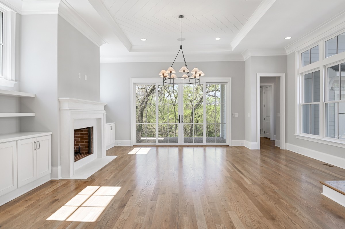 191 Splendor Ridge Drive Franklin, TN 37064 - Photo 13 of 70 a view of an empty room with wooden floor fireplace and a window