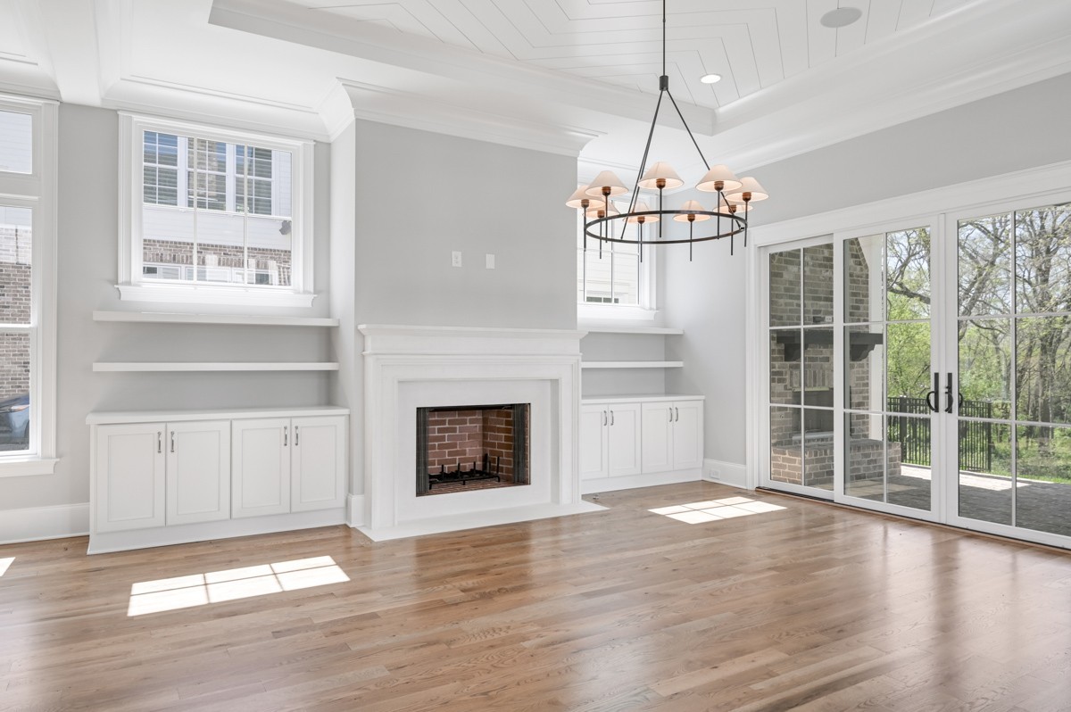 191 Splendor Ridge Drive Franklin, TN 37064 - Photo 15 of 70 a view of a livingroom with wooden floor a fireplace and windows