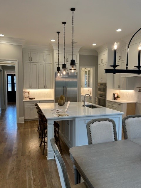 191 Splendor Ridge Drive Franklin, TN 37064 - Photo 20 of 70 a kitchen with a table chairs refrigerator and microwave
