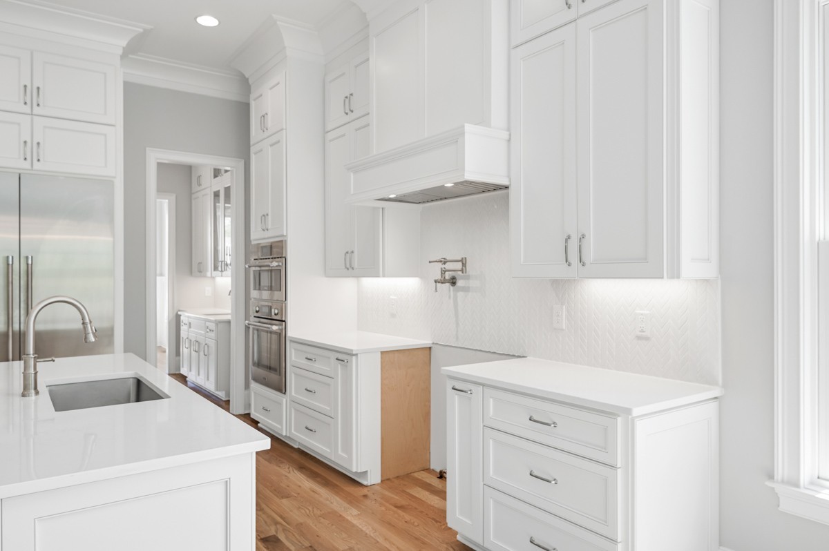 191 Splendor Ridge Drive Franklin, TN 37064 - Photo 25 of 70 a kitchen with white cabinets and white appliances