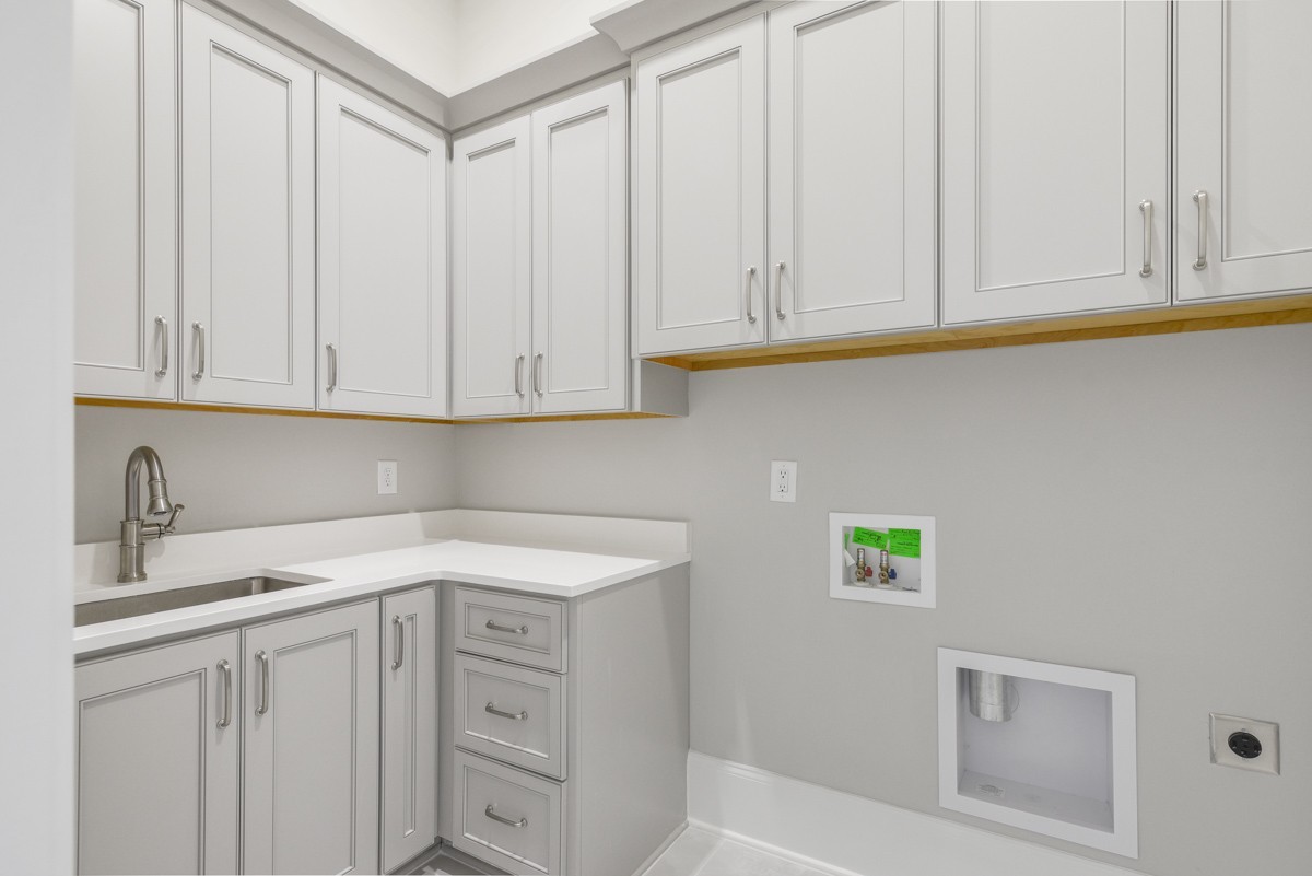 191 Splendor Ridge Drive Franklin, TN 37064 - Photo 39 of 70 a kitchen with white cabinets and a sink