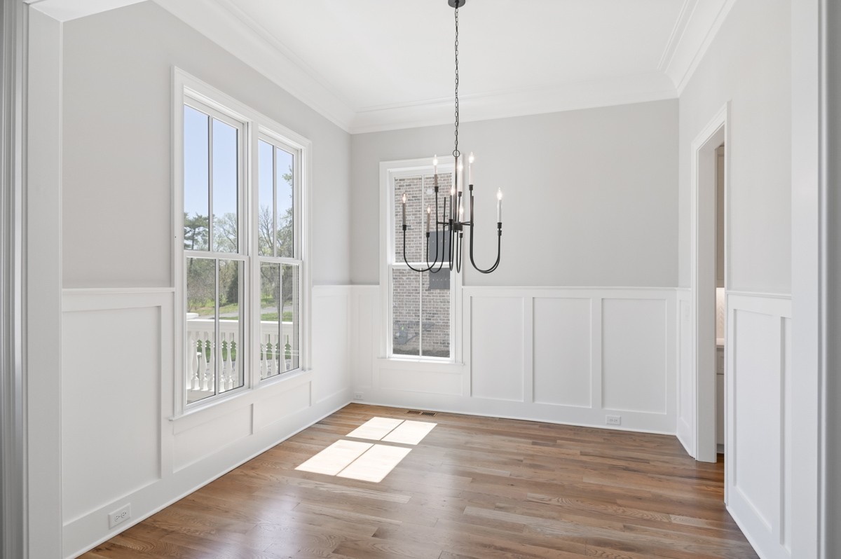 191 Splendor Ridge Drive Franklin, TN 37064 - Photo 7 of 70 a view of an empty room with wooden floor and a window