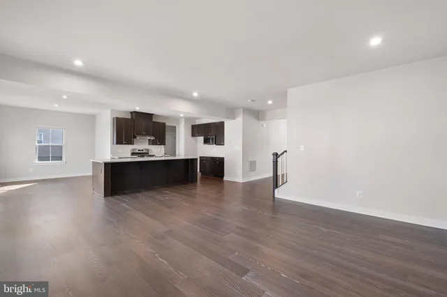 a view of kitchen with a sink and microwave