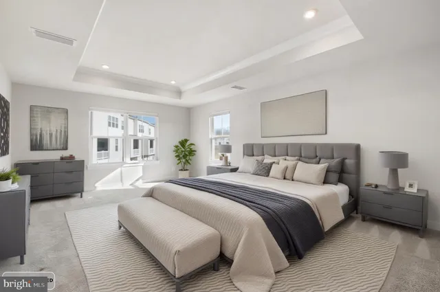 a bedroom with a large bed and furniture