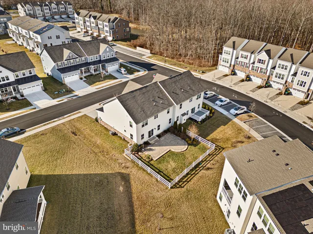 an aerial view of a house with a swimming pool