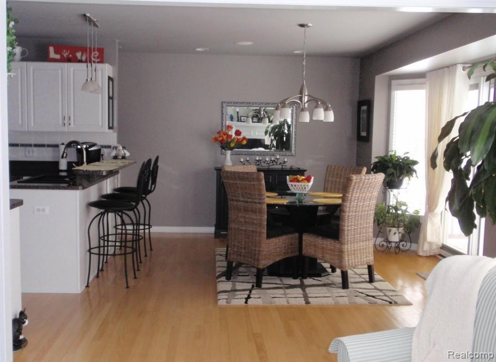47976 Sandy Ridge Drive Macomb, MI 48044 - Photo 6 of 36 Dining area, Open to Great Room, Door wall to Deck and Patio