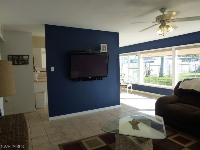 1450 Mandel Road Fort Myers, FL 33919 - Photo 11 of 18 a living room with furniture and a flat screen tv