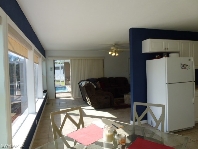 1450 Mandel Road Fort Myers, FL 33919 - Photo 14 of 18 a living room with furniture and a refrigerator