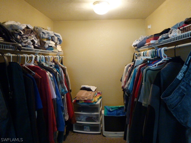 1450 Mandel Road Fort Myers, FL 33919 - Photo 5 of 18 a view of walk in closet with clothes and shoes
