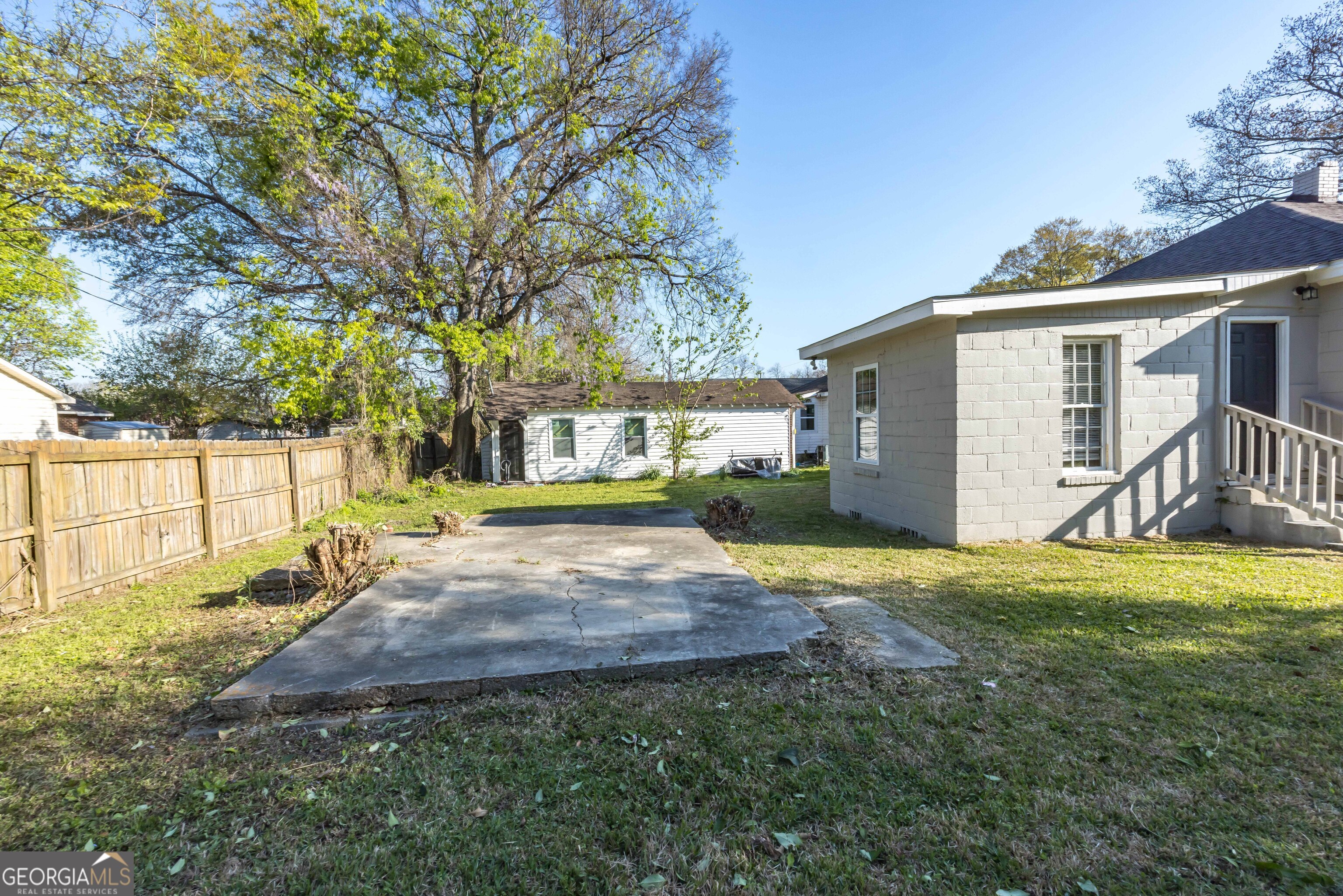 1103 Bryan Avenue Columbus, GA 31906 - Photo 19 of 24 a view of a house with backyard and a tree