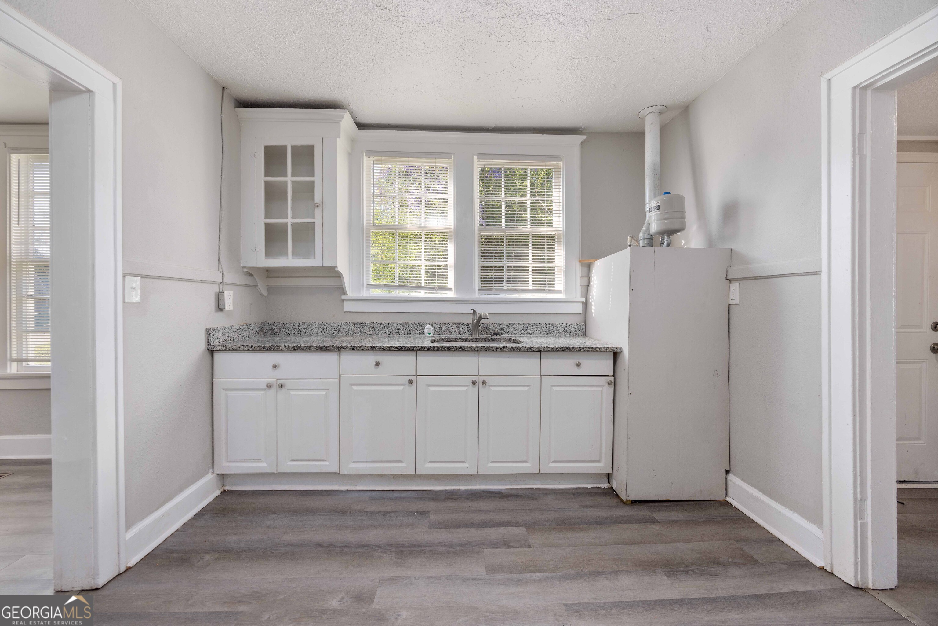 1103 Bryan Avenue Columbus, GA 31906 - Photo 3 of 24 a kitchen with a refrigerator and window