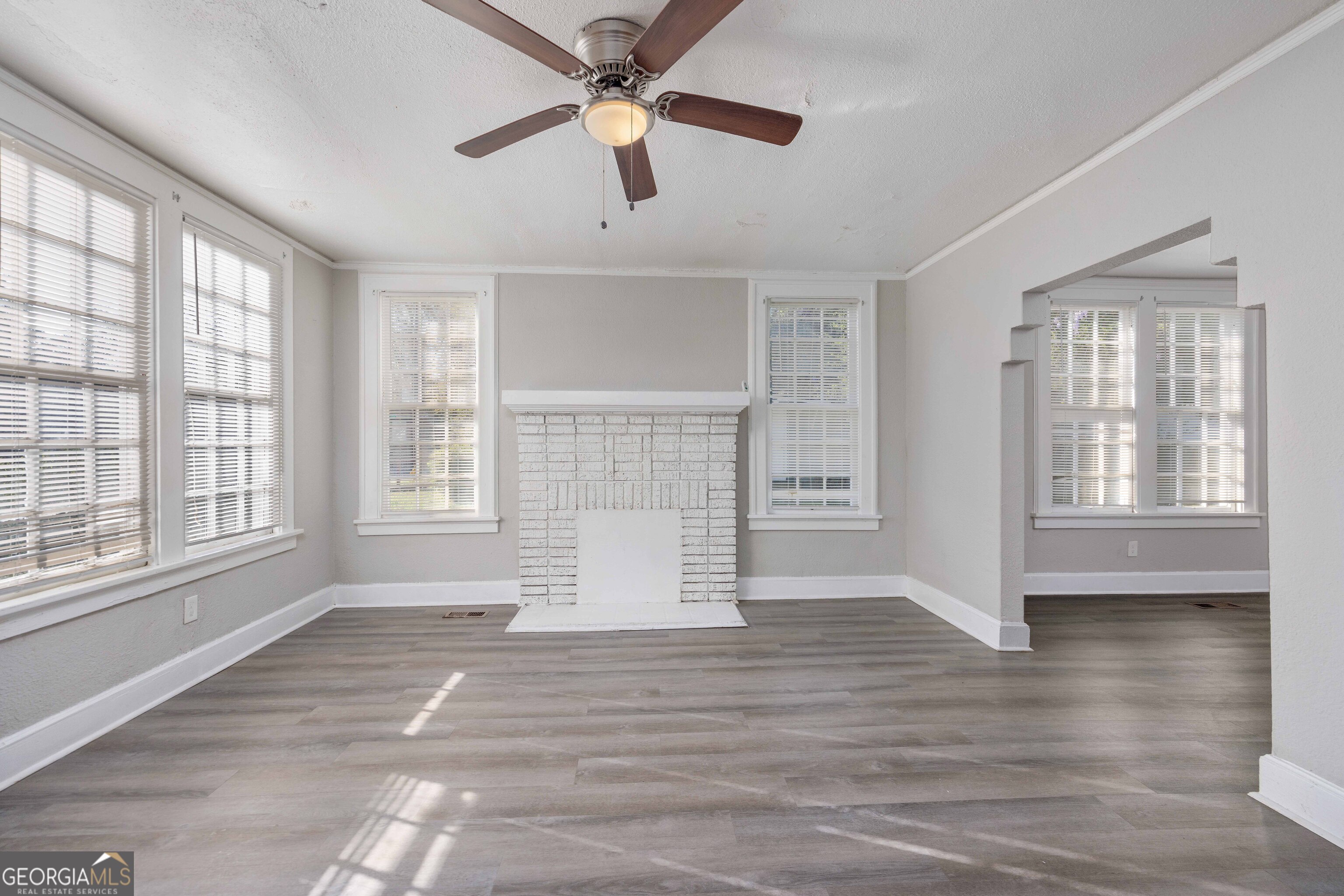 1103 Bryan Avenue Columbus, GA 31906 - Photo 6 of 24 a view of an empty room with wooden floor and a window