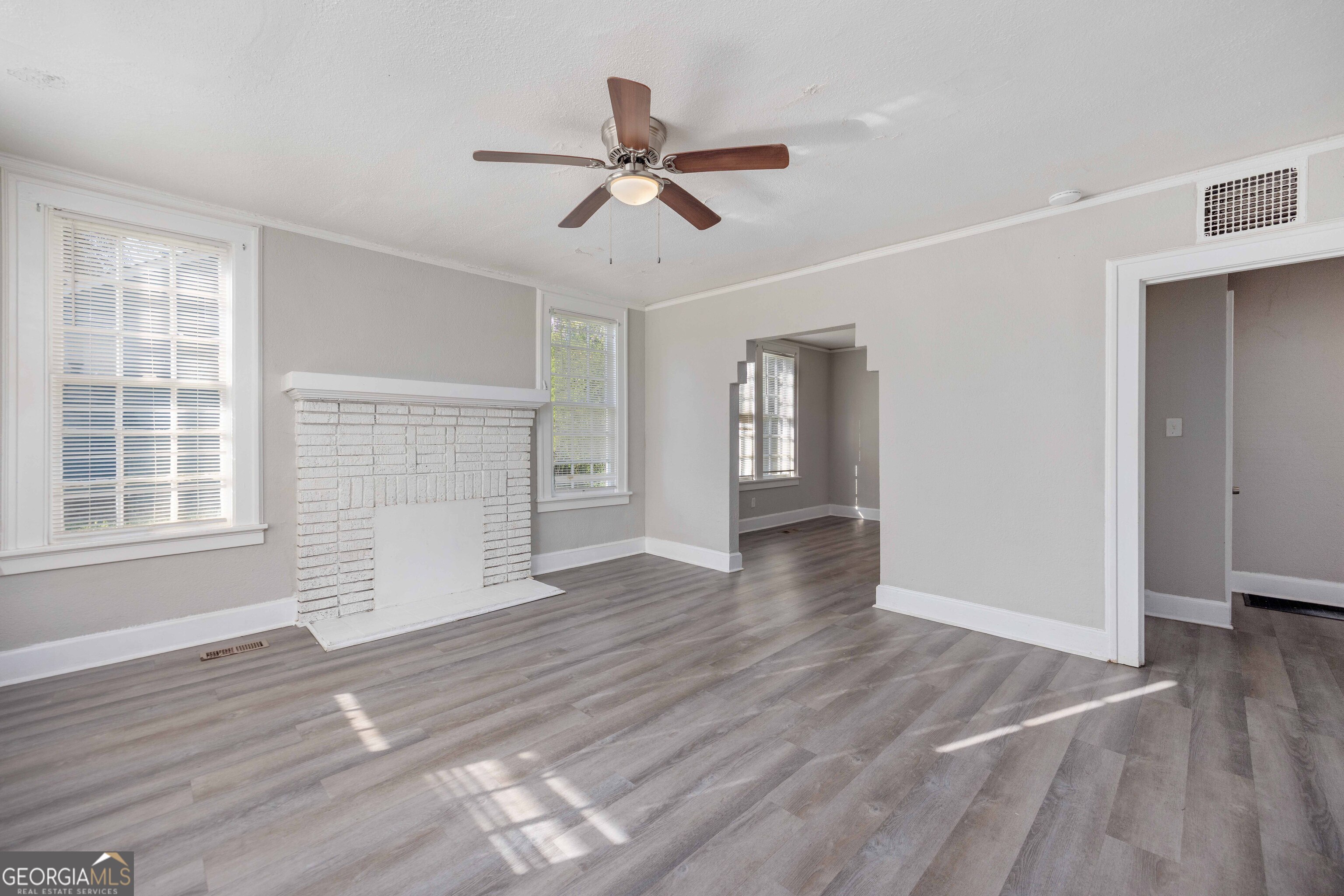 1103 Bryan Avenue Columbus, GA 31906 - Photo 7 of 24 a view of empty room with wooden floor and fan