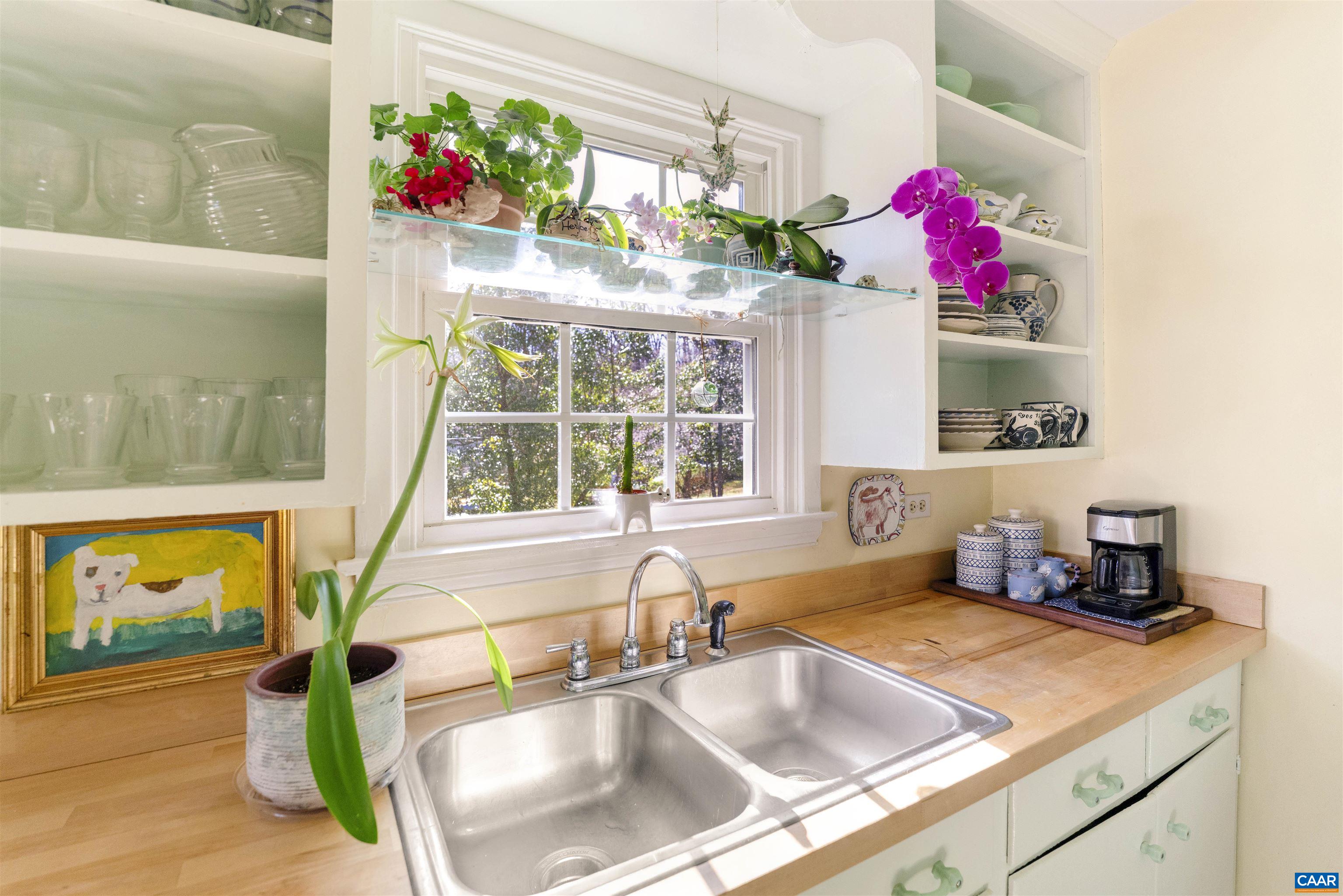 1618 Greenleaf Lane Charlottesville, VA 22903 - Photo 12 of 37 a bathroom with a sink mirror and window