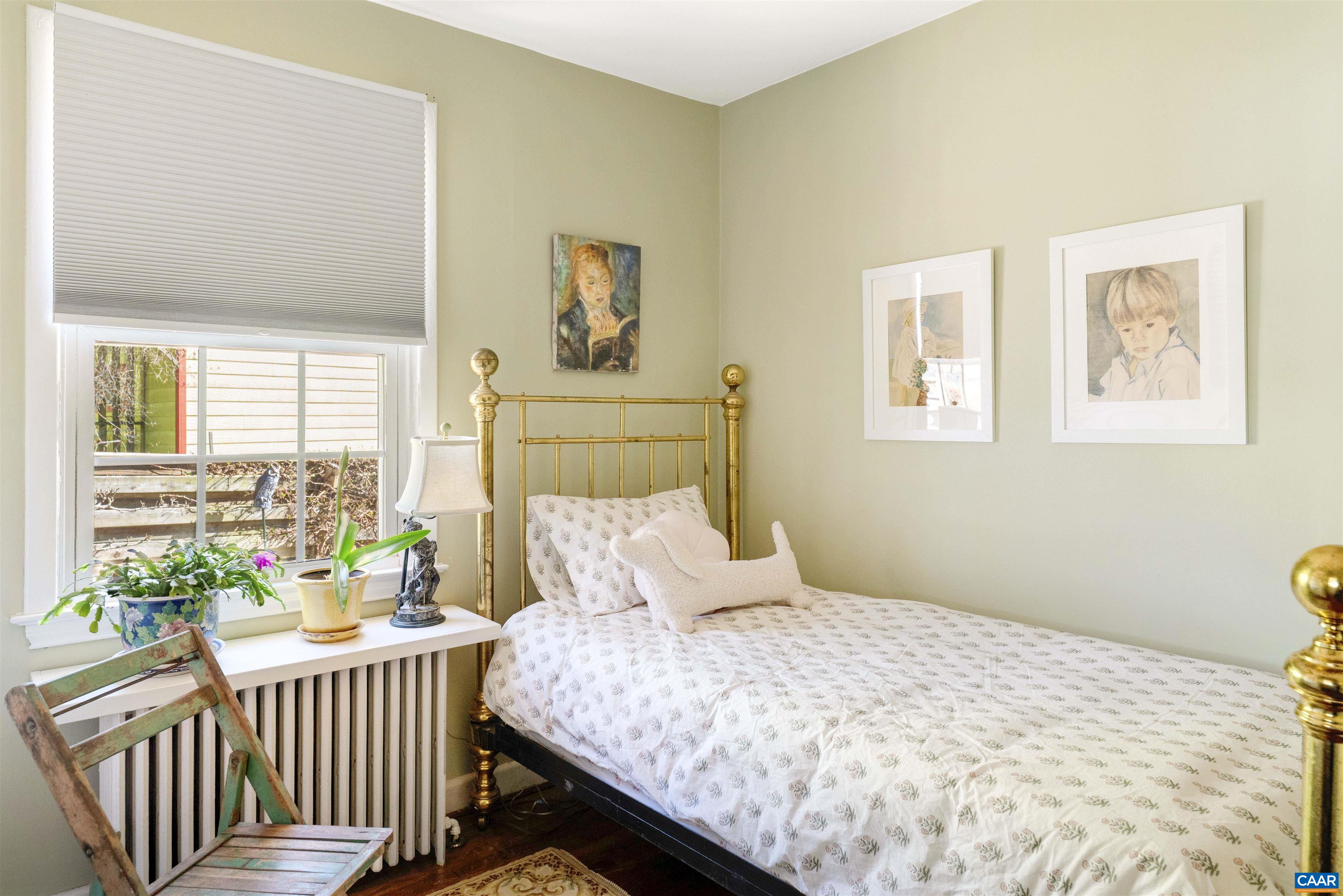 1618 Greenleaf Lane Charlottesville, VA 22903 - Photo 17 of 37 a bedroom with a bed and a table