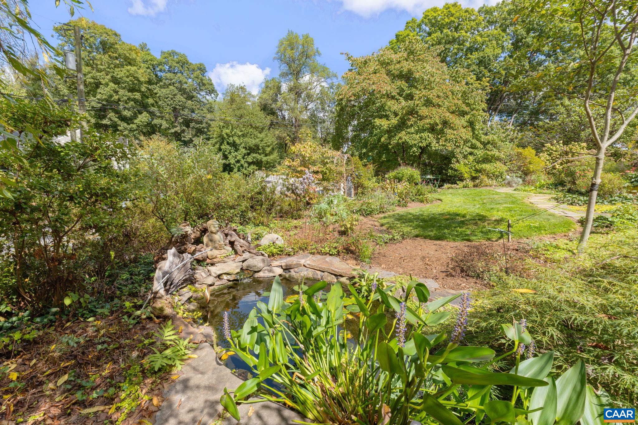 1618 Greenleaf Lane Charlottesville, VA 22903 - Photo 34 of 37 a view of a yard with plants and large trees