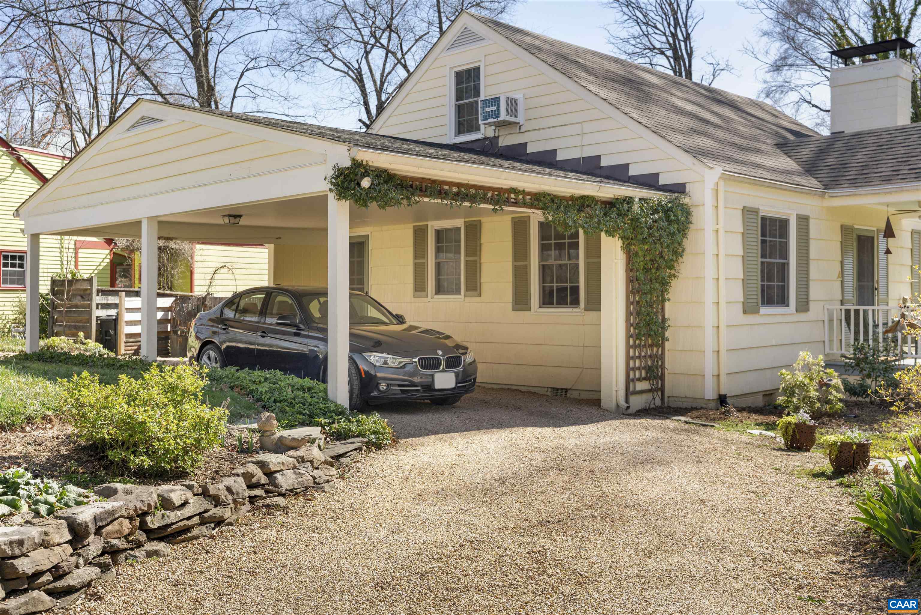 1618 Greenleaf Lane Charlottesville, VA 22903 - Photo 37 of 37 a view of a house with a large window and potted plants