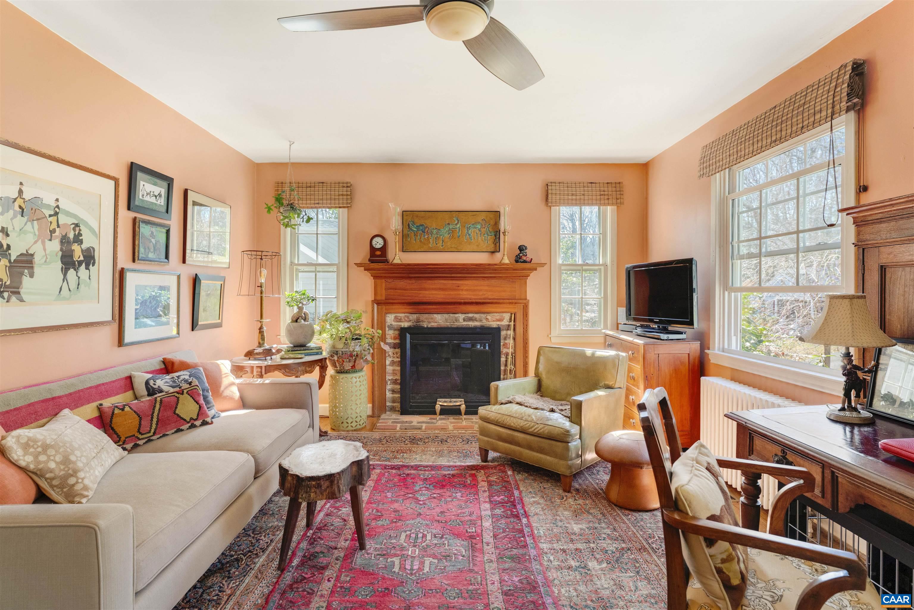 1618 Greenleaf Lane Charlottesville, VA 22903 - Photo 4 of 37 a living room with furniture fireplace and a large window