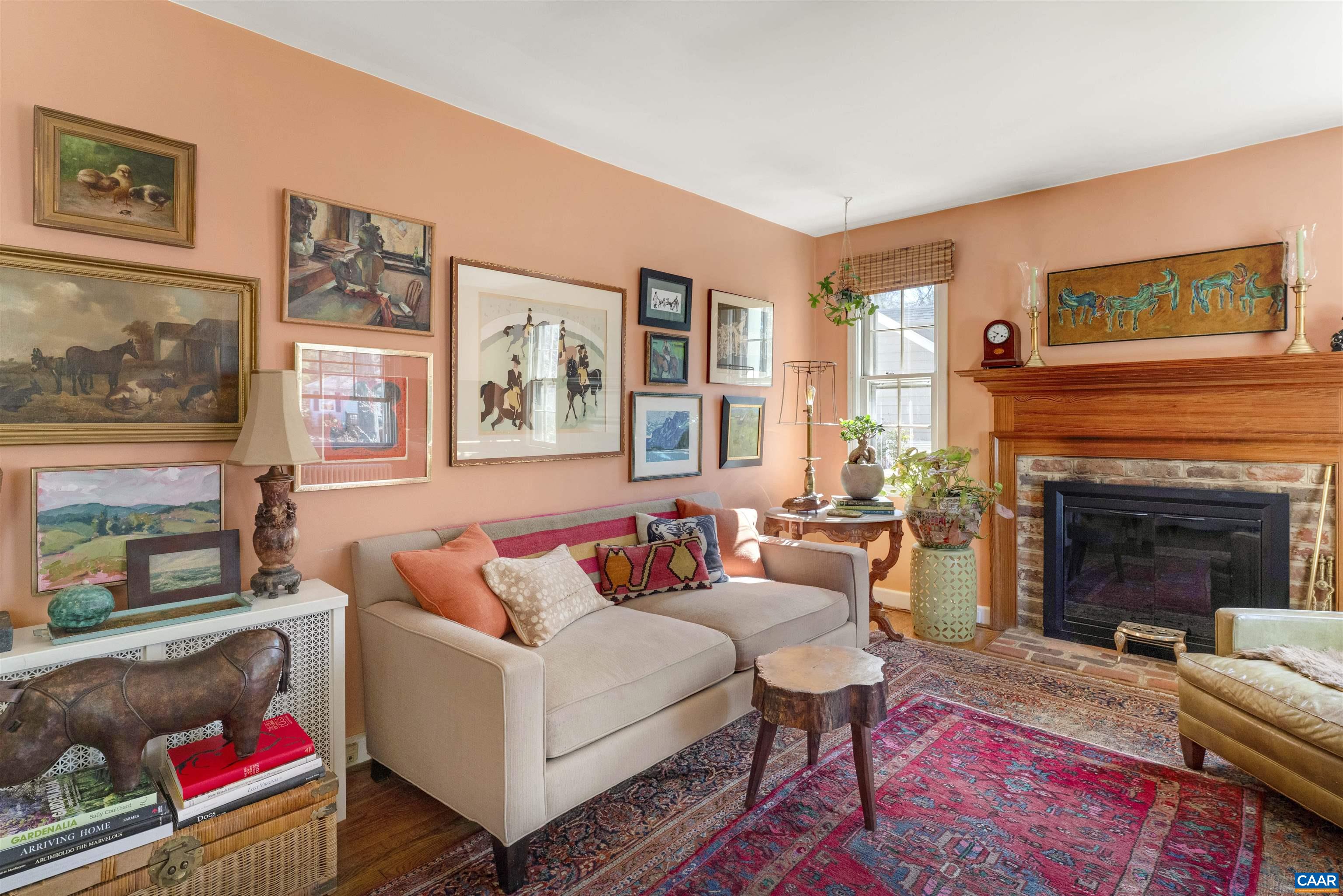 1618 Greenleaf Lane Charlottesville, VA 22903 - Photo 5 of 37 a living room with furniture a flat screen tv and a fireplace