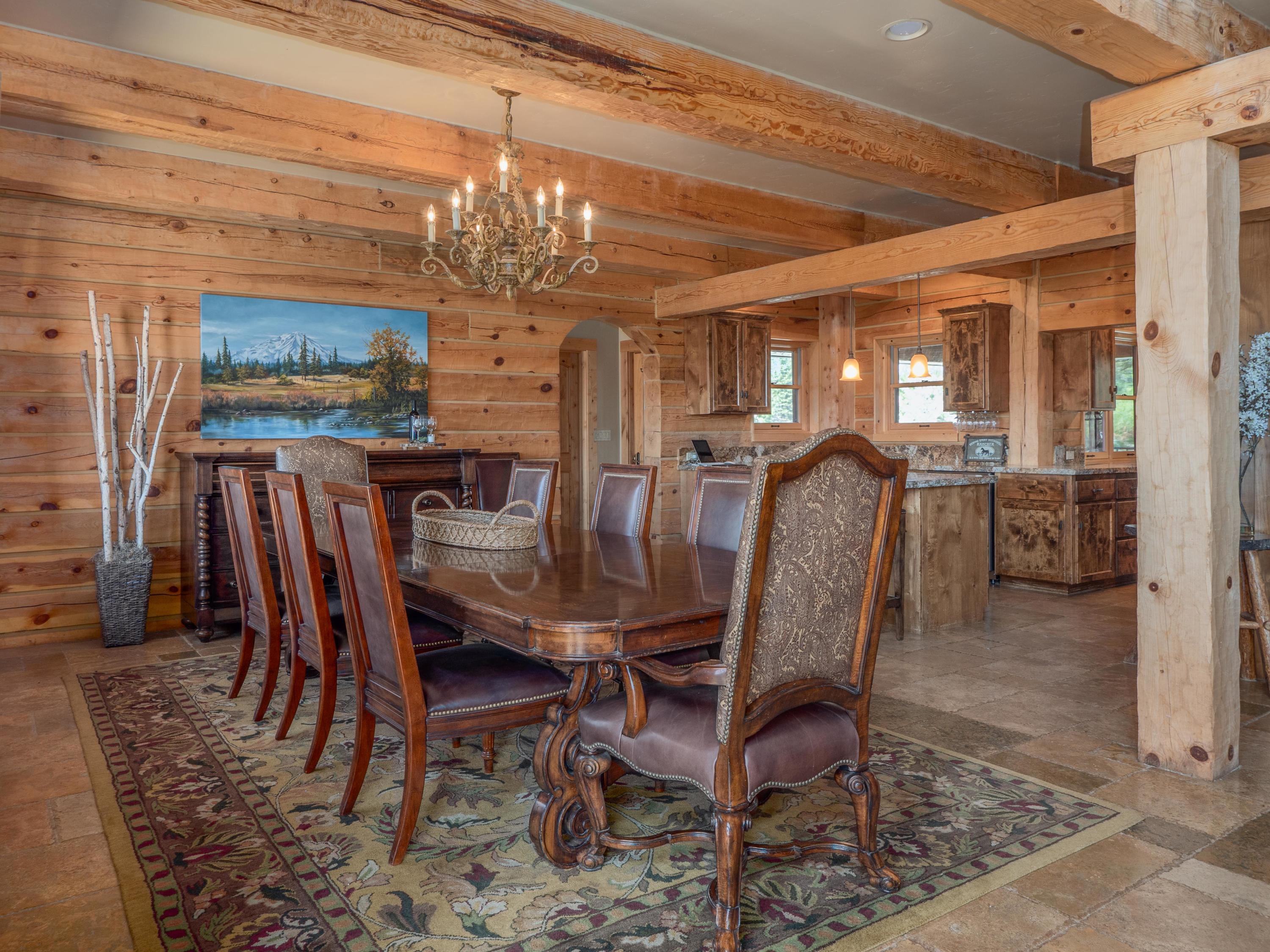 40900 Brown Road Fall River Mills, CA 96028 - Photo 15 of 72 a view of a dining room with furniture a chandelier and wooden floor