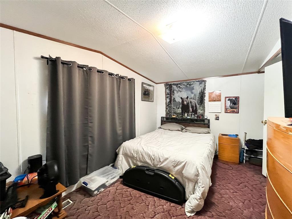 148 Rule Tx 79547 Rule, TX 79547 - Photo 12 of 39 a bedroom with a bed and a window